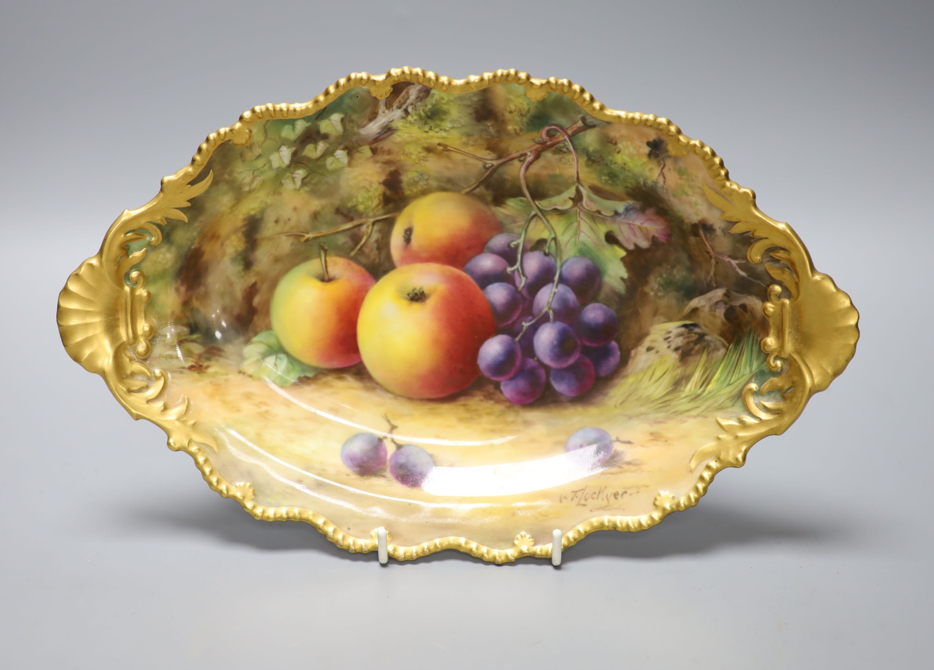 A Royal Worcester fruit painted dessert dish, signed Lockyer, length 31cm